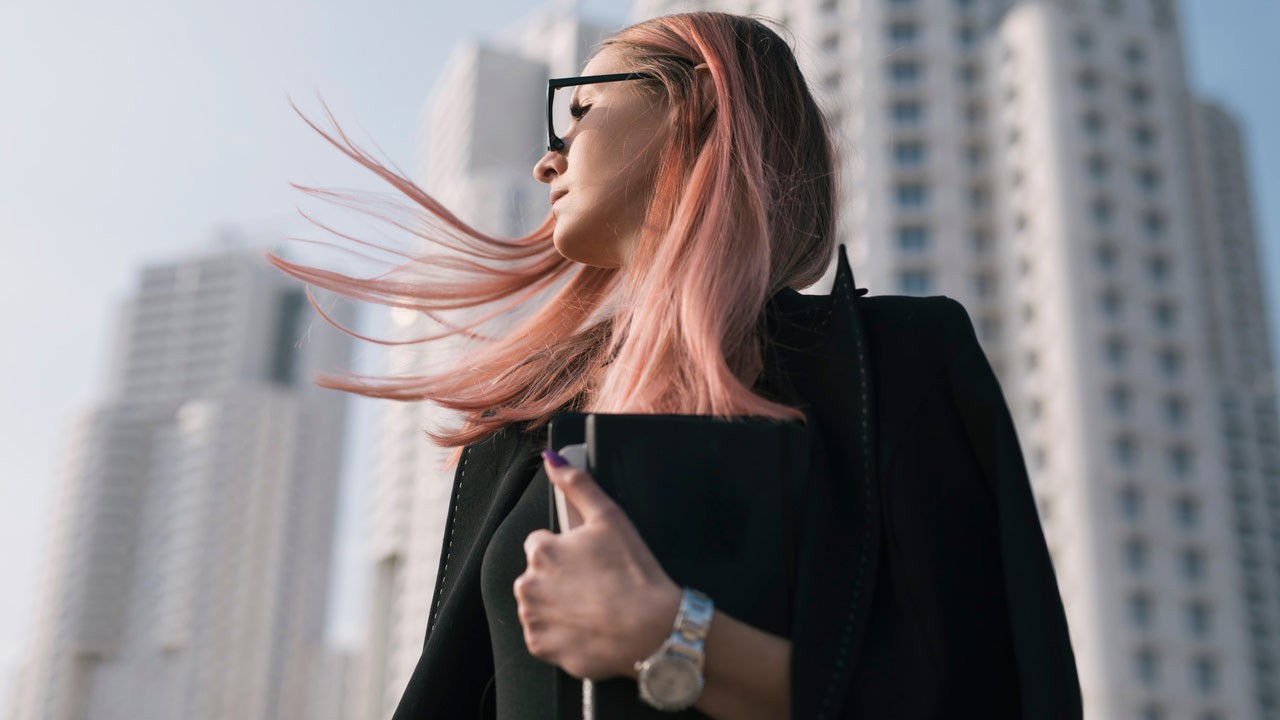 pink hair woman working in the city