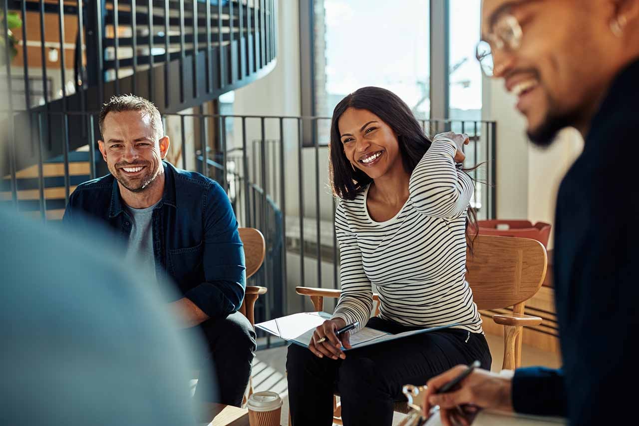 laughing businesspeople in meeting